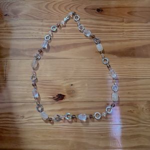 Clear, tan and light brown stones with silver accent.